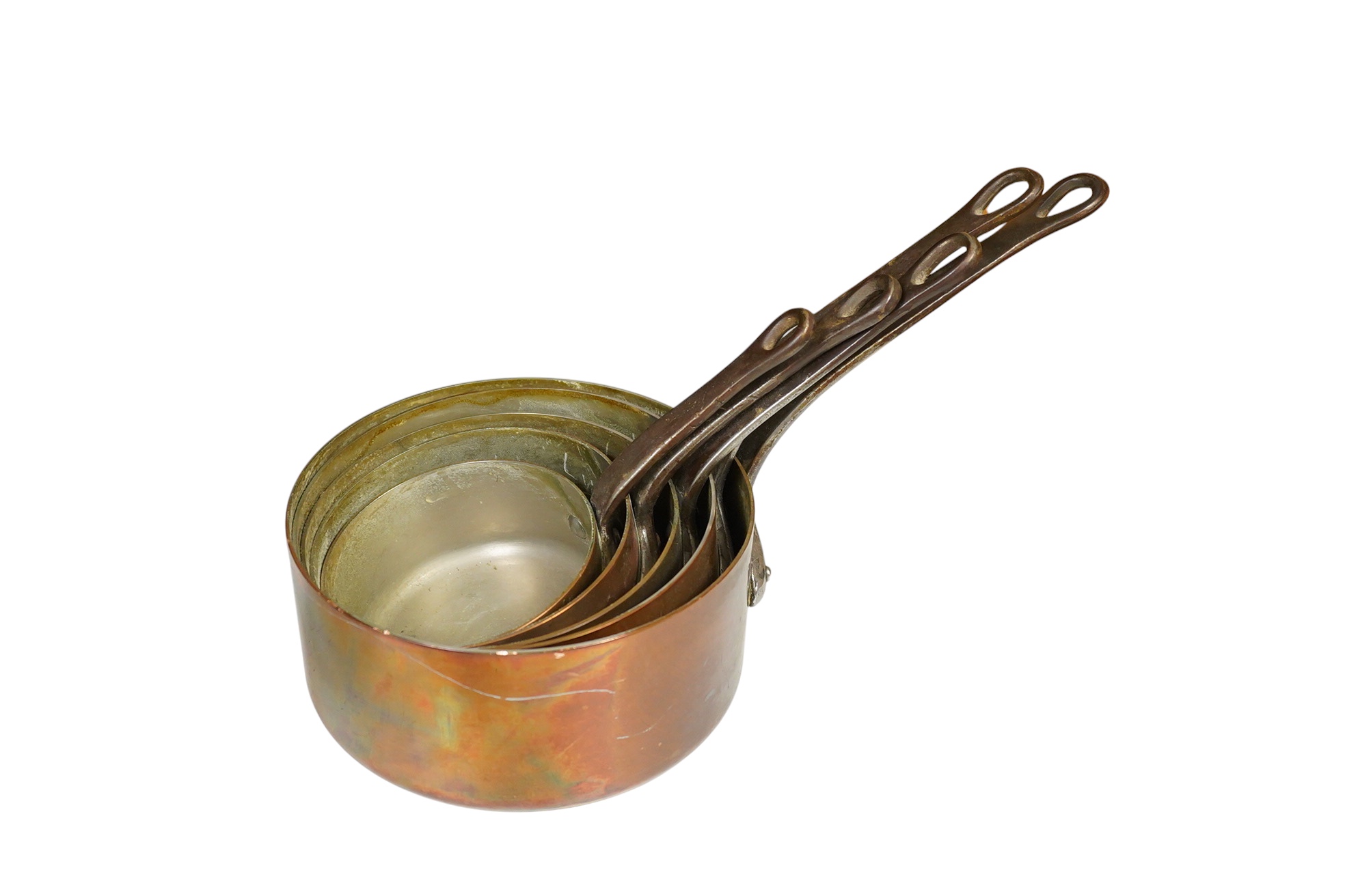 A graduated set of five copper saucepans